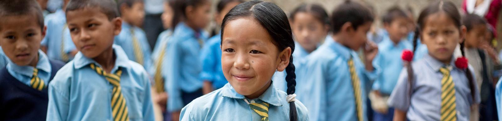 Sanju Rai, 9, during the morning assembly in the school in Nepal