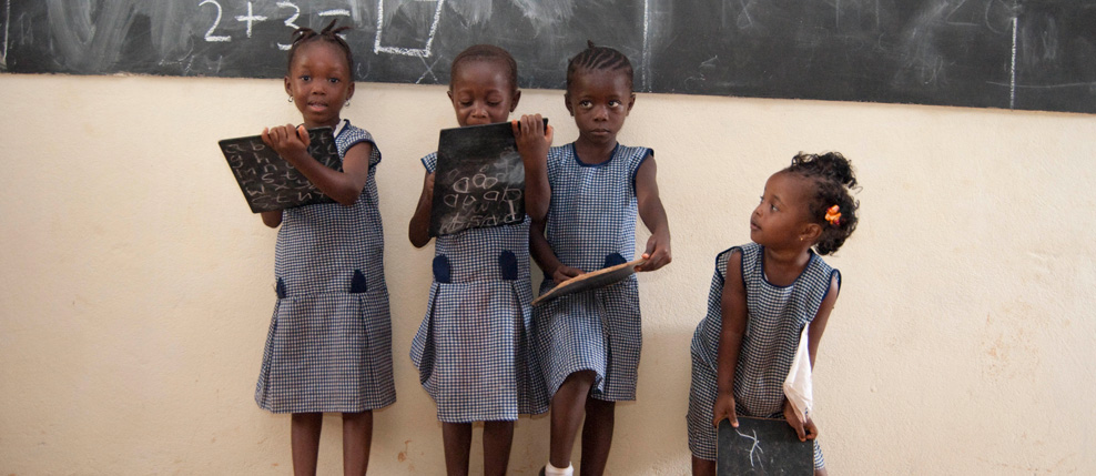 Kariah Sherrif (L), Mary Koroma (Second on left), Zainab Sesay (Second on right) & Millicent Kamara (R) in the kindergarten at Kola Tree Community School, Western Area, Sierra Leone
