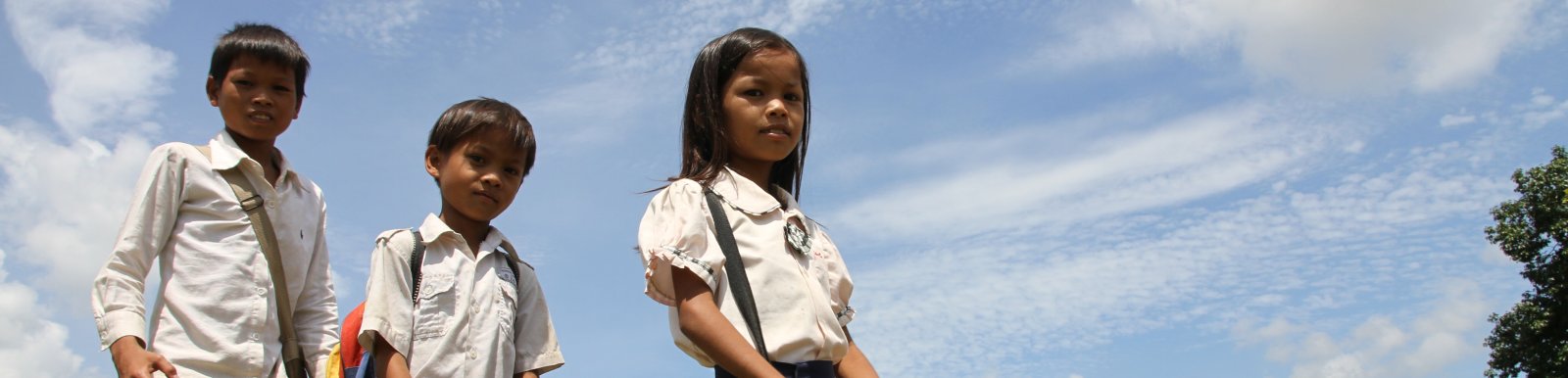 Srey Yeng, 8-year old girl, walking to school with her brothers. Srey Yeng, 8-year old girl, walking to school with her brothers.