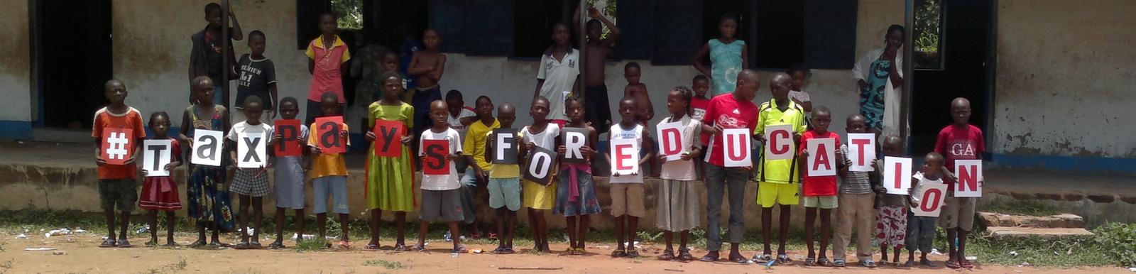 Pupils at the Activista Free Holiday Coaching Lesson in Tionsha community in Benue State Nigeria taking action as part of the Tax Power Campaign Pupils at the Activista Free Holiday Coaching Lesson in Tionsha community in Benue State Nigeria taking action as part of the Tax Power Campaign